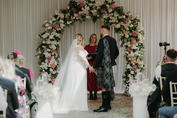 Real bride wearing the Celtic Pearl crepe bridal gown during her wedding ceremony