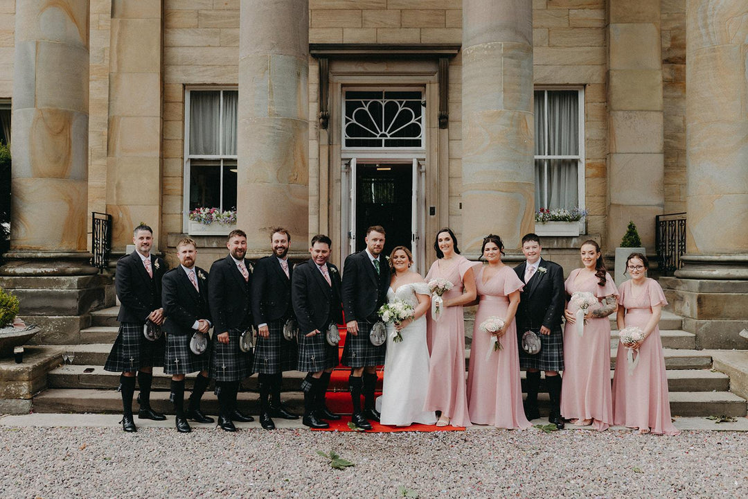 Celtic Pearl bride with bridesmaids and groomsmen at a traditional Scottish wedding