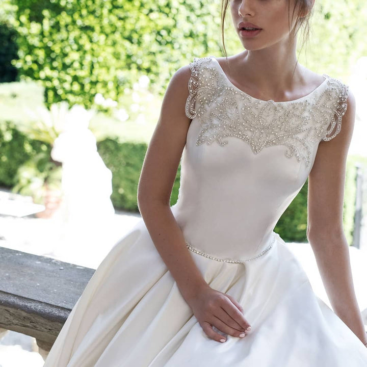 Crystal beaded Mikado wedding ball gown with structured full skirt