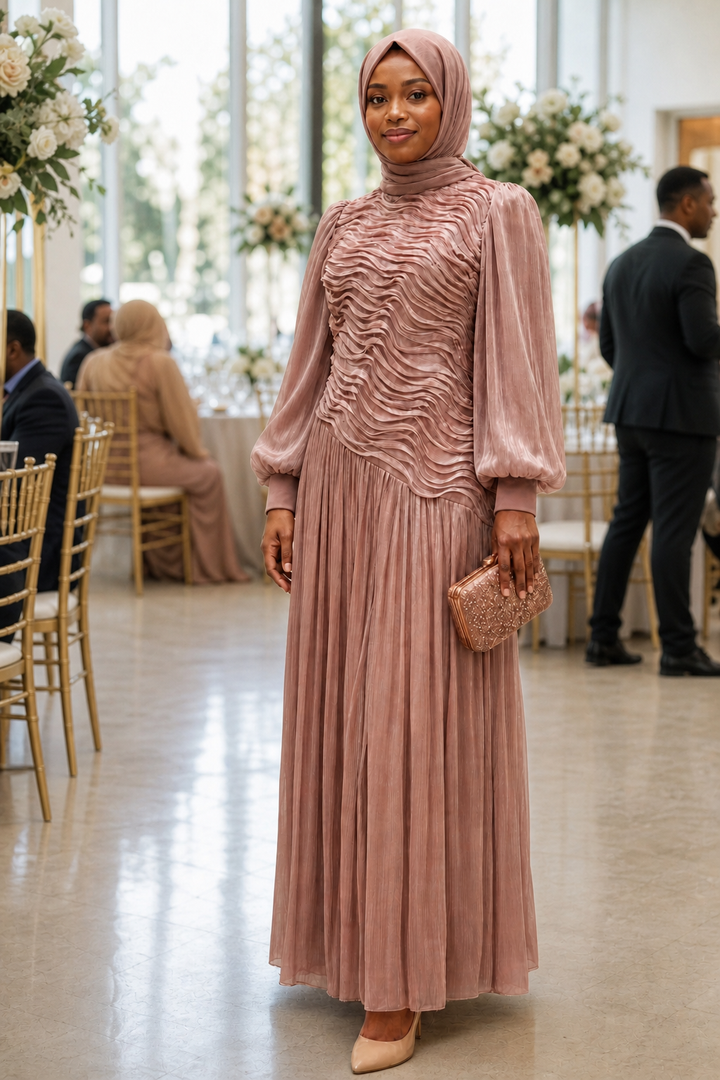 Dusty rose modest wedding guest dress with textured bodice and pleated skirt at an elegant reception