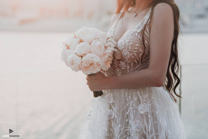 Close-up of intricate lace detailing on the Arabian Royal bridal gown