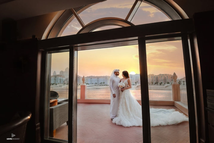 Real Aisha Fashion World bride wearing a luxury lace wedding gown in Qatar
