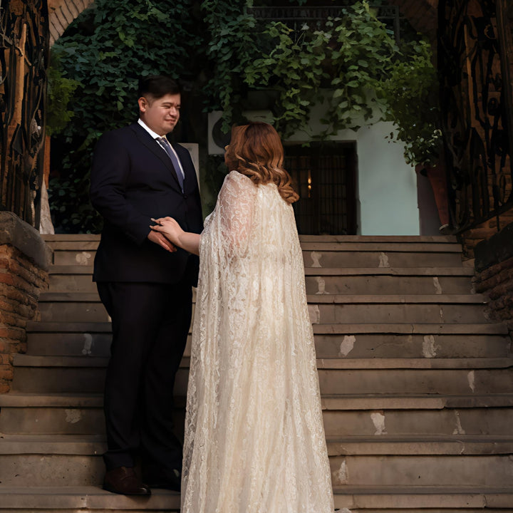 Ethereal Lace Cape Wedding Dress – Elegant Flowing Train | Aisha Fashion World Bridal
