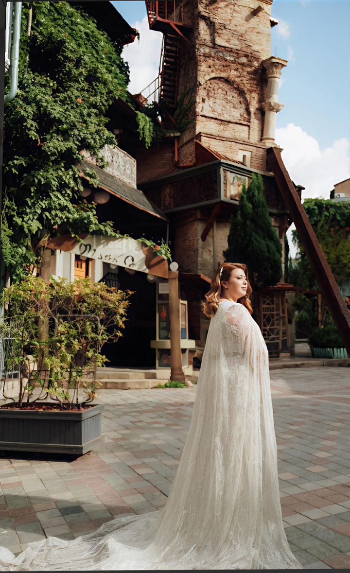 Ethereal Lace Cape Wedding Dress – Elegant Flowing Train | Aisha Fashion World Bridal