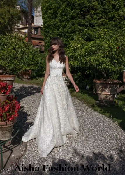 Leave a lasting impression on your wedding day with the AFW Veronika Handmade Lace Wedding Dress. This elegant and timeless dress is crafted with premium handmade lace, making it the perfect choice for the bride who is looking for a classic and sophisticated look.